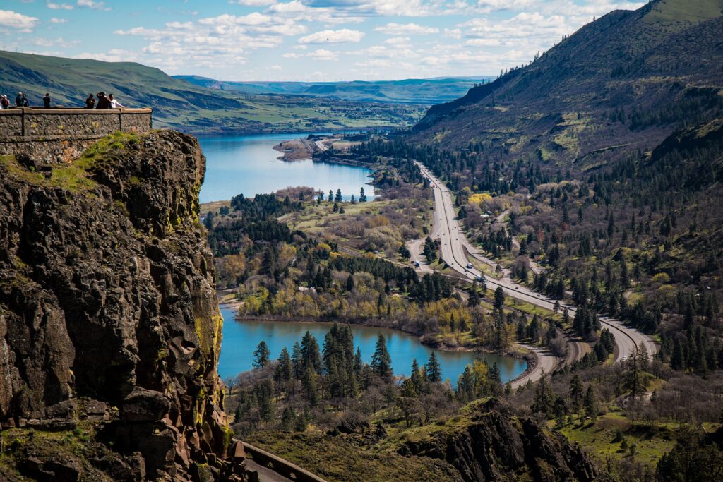 Breathtaking vista of Rowena Crest at Columbia River Gorge with lush valleys and winding roads.